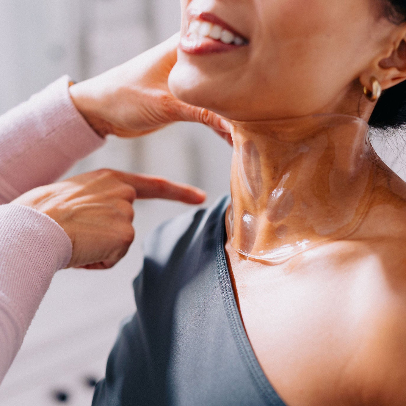 Frownies apple neck mask on a woman's neck 