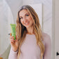 Frownies daily body lotion aroma therapy being held by a woman 