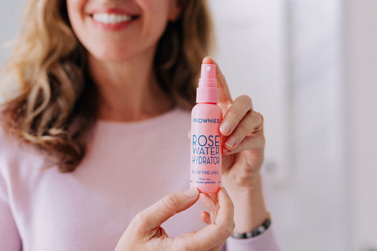 woman's hands holding frownies rose water spray with hyaluronic acid The Frownies   