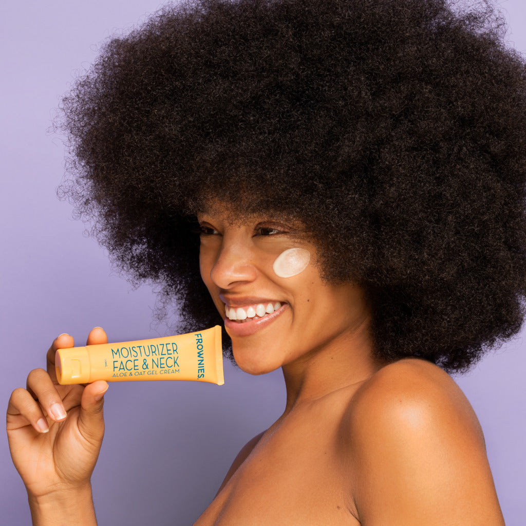 woman holding Aloe & Oat Gel Moisturizer Face & Neck (2 oz) Skincare Products Frownies   
