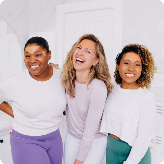 group of 3 women laughing wearing frownies facial patches on forehead for forehead wrinkles and 11 lines