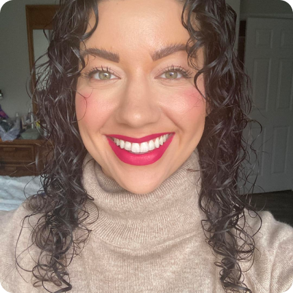 beautiful woman with smooth glowing skin and bold makeup